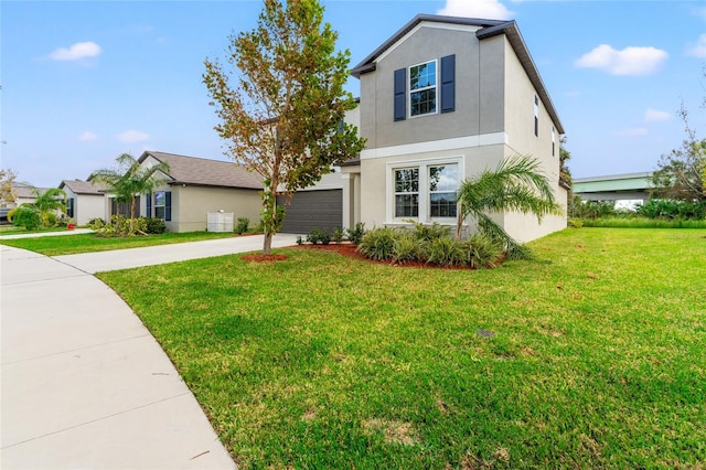 front of property with a front lawn and a garage