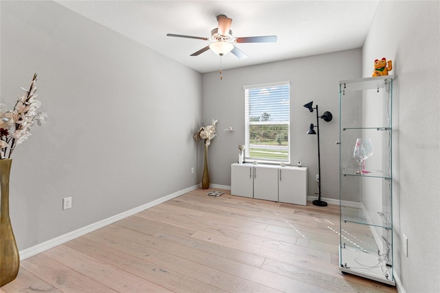 spare room with ceiling fan and light hardwood / wood-style flooring