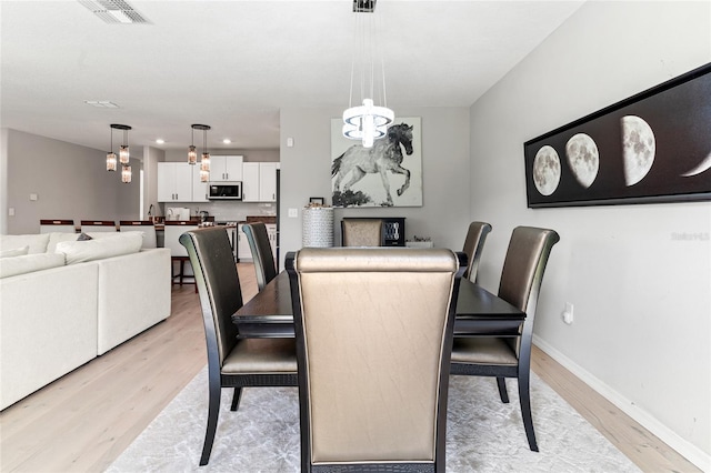 dining space featuring light hardwood / wood-style floors