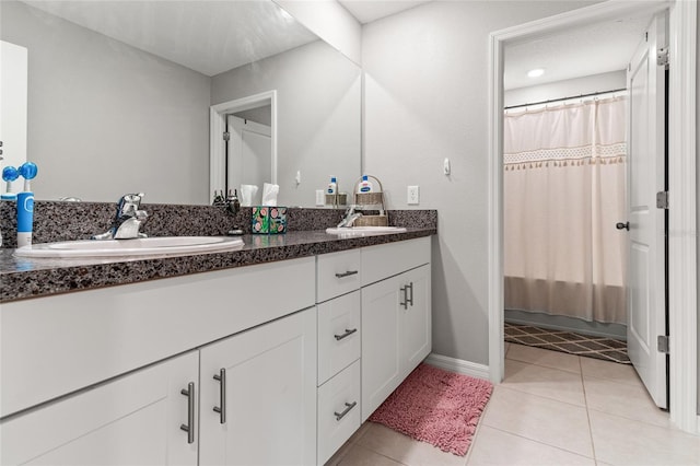 bathroom featuring vanity and tile patterned flooring