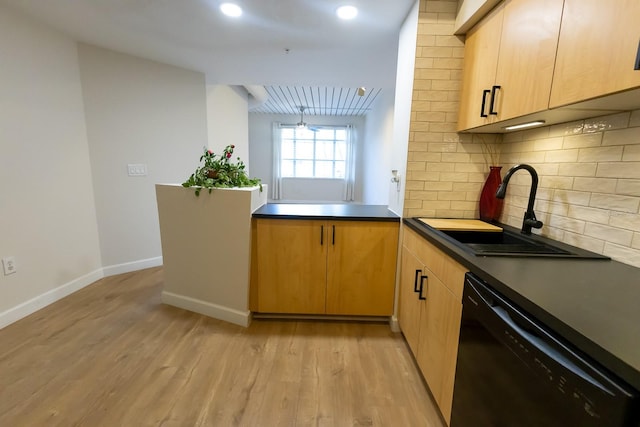 kitchen with sink, black dishwasher, kitchen peninsula, light hardwood / wood-style floors, and decorative backsplash