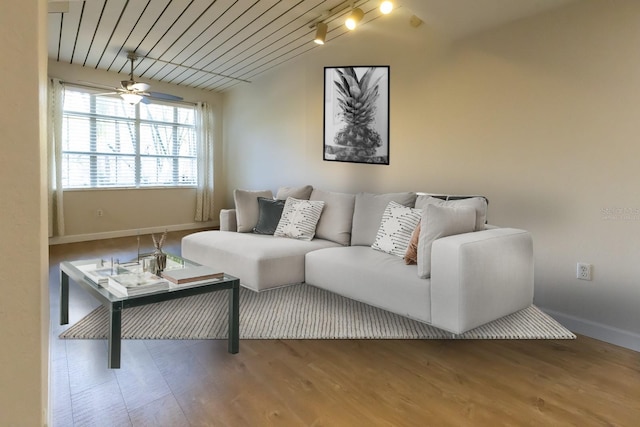 living room with hardwood / wood-style floors, ceiling fan, and wooden ceiling