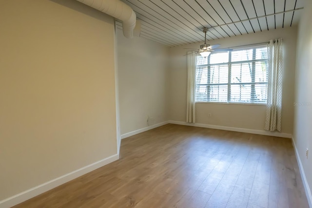 empty room featuring ceiling fan and light wood-type flooring