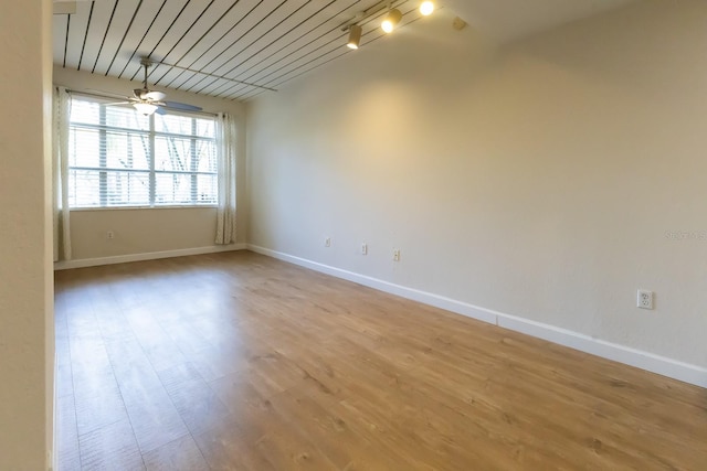 empty room with light wood-type flooring and ceiling fan