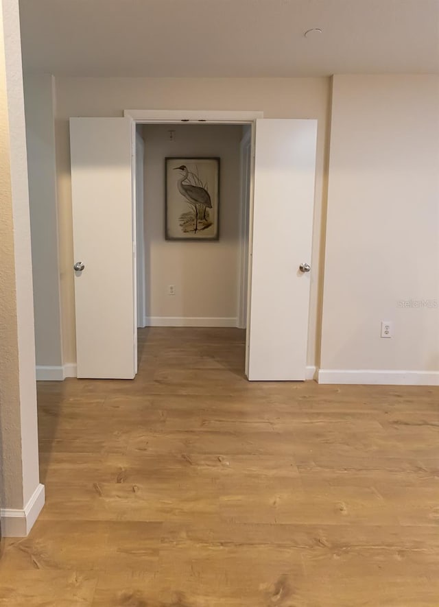 hallway featuring light hardwood / wood-style flooring