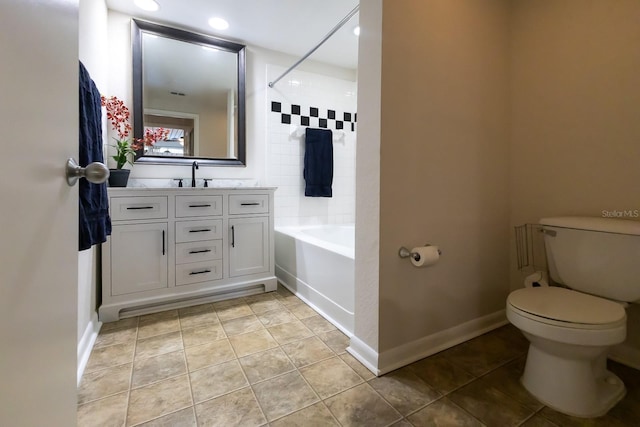 bathroom featuring tile patterned floors, vanity, and toilet