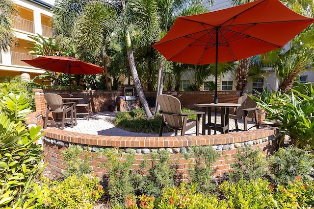 view of patio with a fireplace