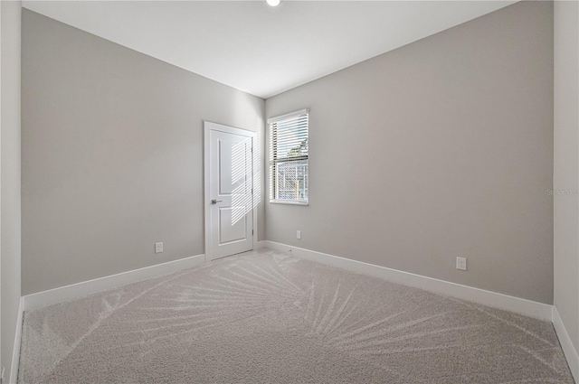 unfurnished room featuring carpet