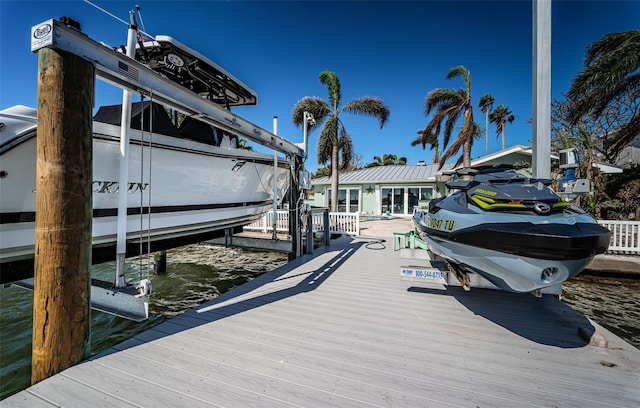 dock area with a water view