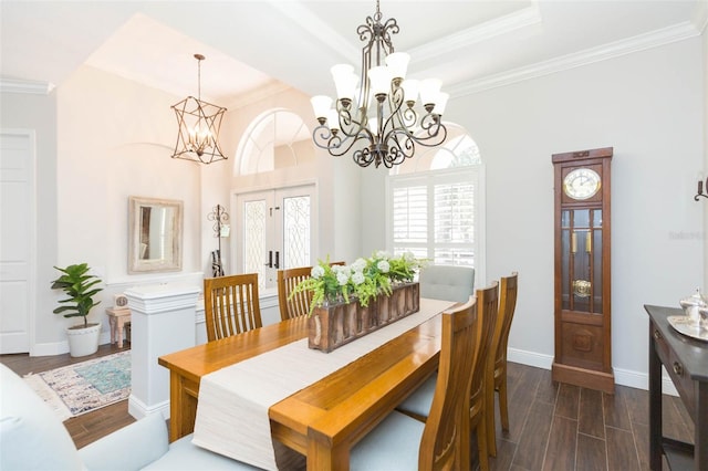 dining area with french doors, an inviting chandelier, dark hardwood / wood-style flooring, and ornamental molding