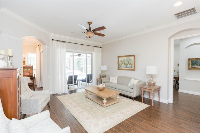 living room featuring ornamental molding, dark hardwood / wood-style flooring, and ceiling fan