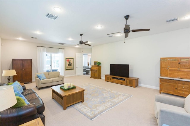 living room with light colored carpet and ceiling fan