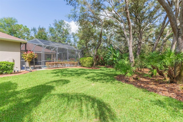 view of yard featuring glass enclosure