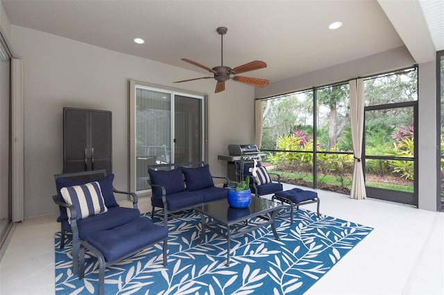 interior space with ceiling fan