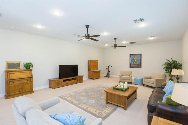 living room featuring light colored carpet and ceiling fan