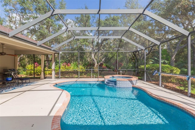 view of swimming pool featuring glass enclosure, a patio, and an in ground hot tub