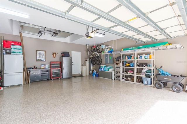 garage featuring stainless steel fridge, white fridge, and a garage door opener