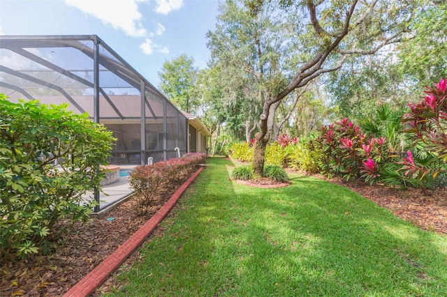 view of yard with glass enclosure