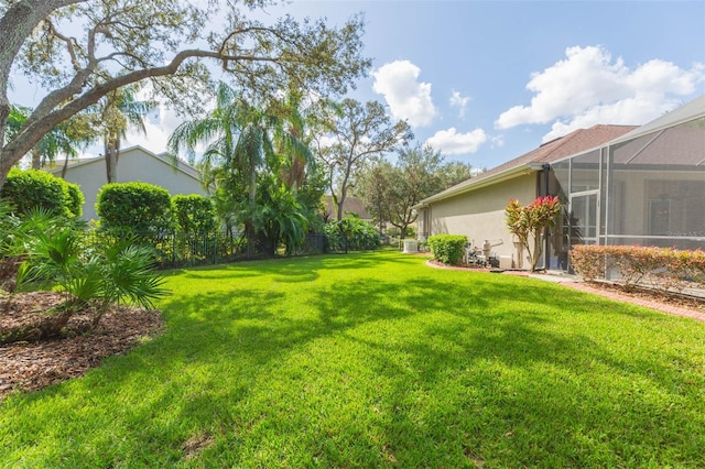 view of yard with a lanai