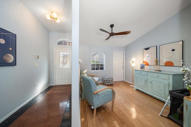 foyer featuring vaulted ceiling and ceiling fan