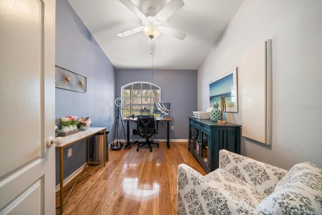 home office featuring ceiling fan and hardwood / wood-style flooring