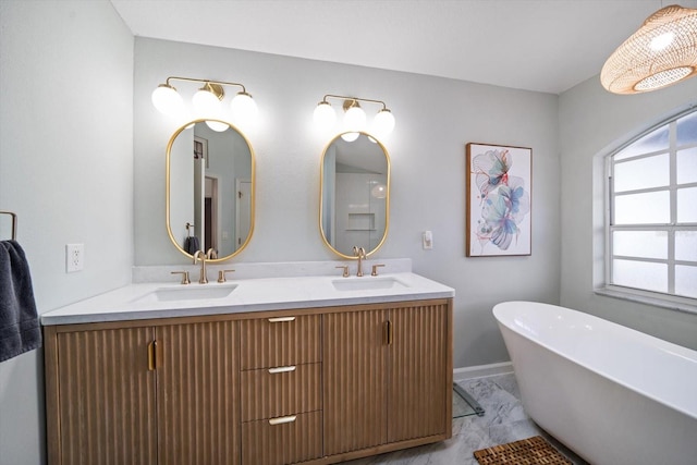 bathroom with vanity and a tub