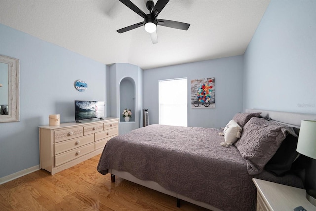 bedroom with ceiling fan and light wood-type flooring