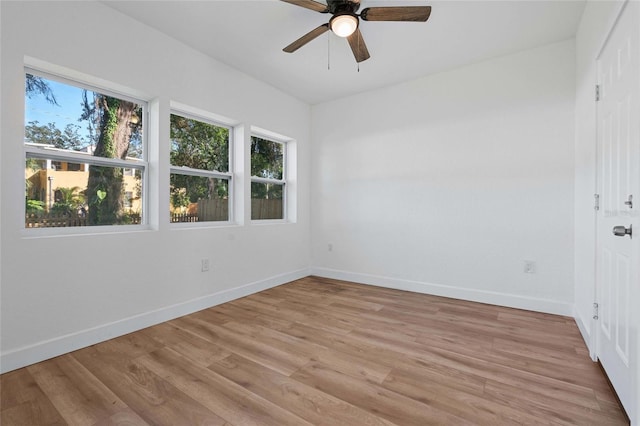 unfurnished room with ceiling fan and light wood-type flooring