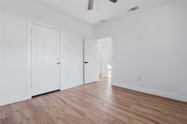 unfurnished bedroom with ceiling fan and light hardwood / wood-style flooring