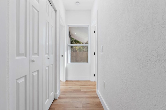 corridor featuring light hardwood / wood-style flooring