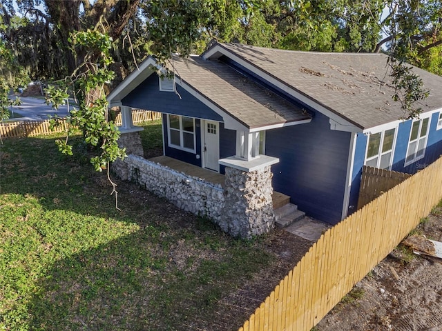 craftsman-style house with covered porch and a front yard