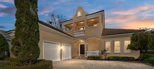 view of front of house with a balcony and a garage