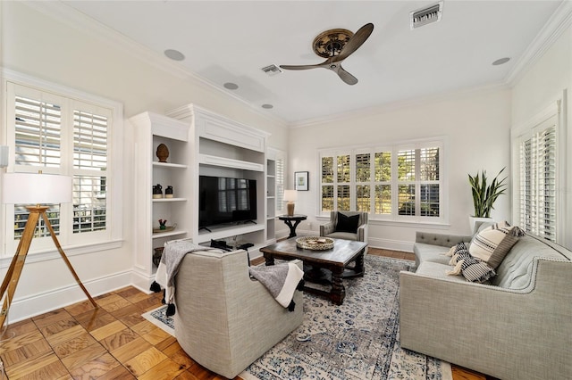 living room featuring ornamental molding, light parquet flooring, and ceiling fan