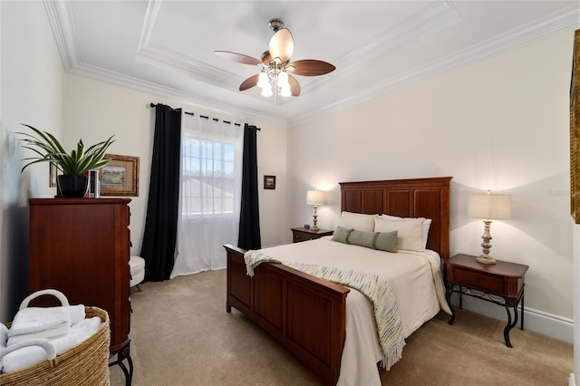 carpeted bedroom with crown molding, a raised ceiling, and ceiling fan