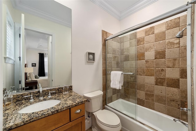 full bathroom featuring vanity, toilet, crown molding, and shower / bath combination with glass door