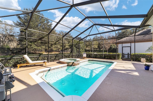 view of pool with an in ground hot tub, a patio area, and a lanai