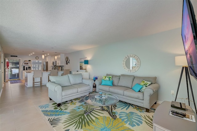 tiled living room with a textured ceiling