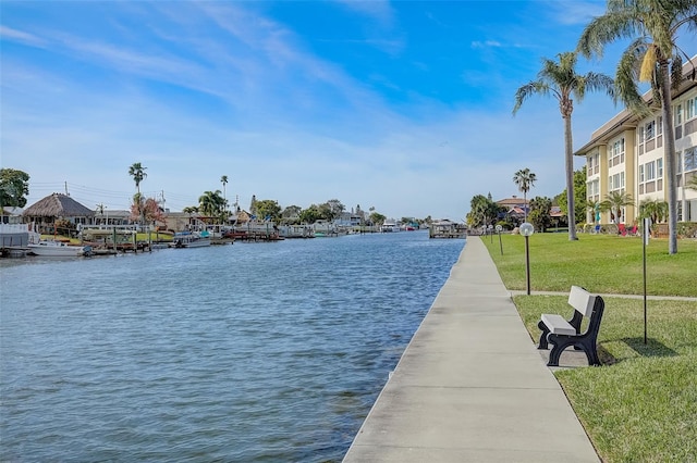 exterior space with a water view and a yard