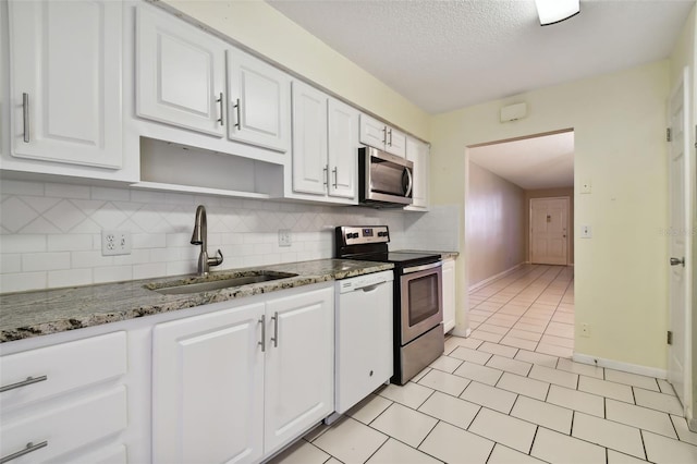 kitchen featuring sink, white cabinets, and stainless steel appliances