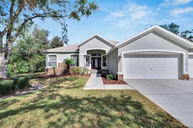 ranch-style home featuring a front yard and a garage