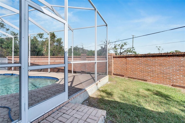 view of yard featuring glass enclosure