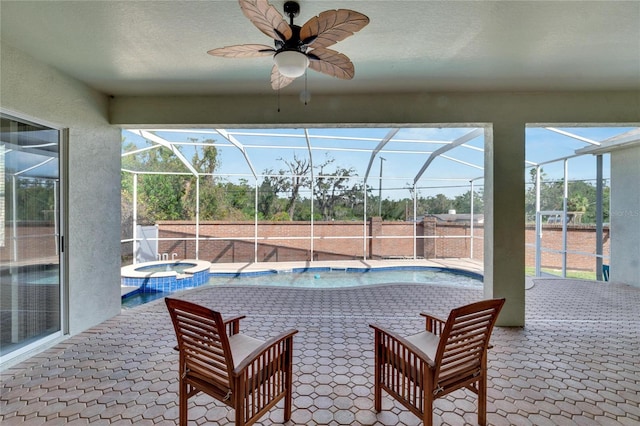 view of patio featuring ceiling fan, a lanai, and a pool with hot tub