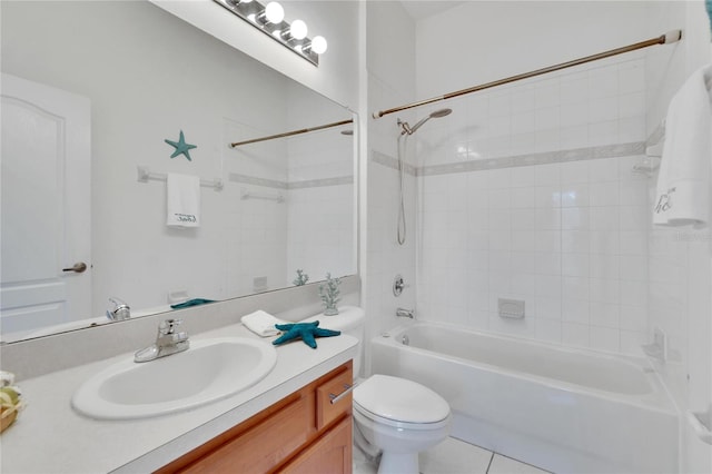 full bathroom with vanity, tiled shower / bath combo, toilet, and tile patterned flooring