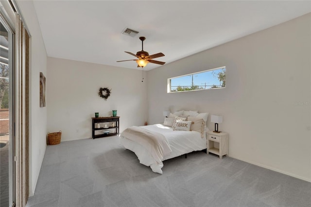 bedroom with light carpet and ceiling fan