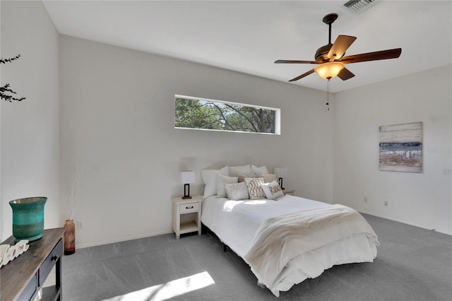 bedroom featuring ceiling fan and dark colored carpet