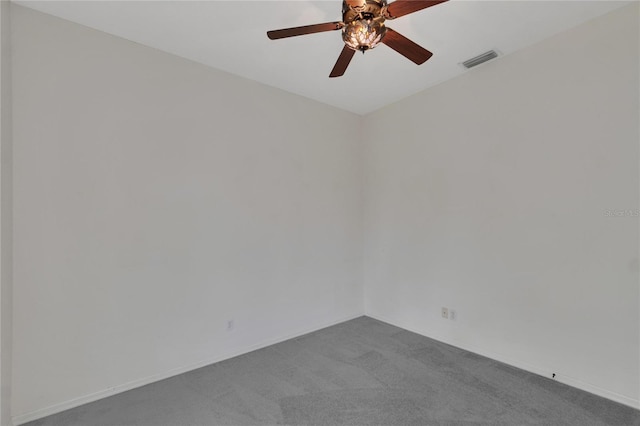 unfurnished room featuring ceiling fan and carpet