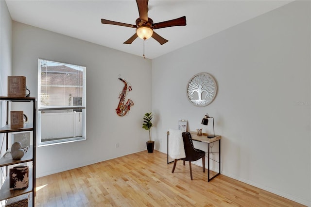 office area featuring light hardwood / wood-style flooring and ceiling fan