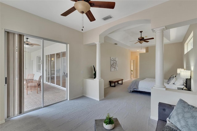 bedroom featuring decorative columns, light carpet, access to outside, and ceiling fan