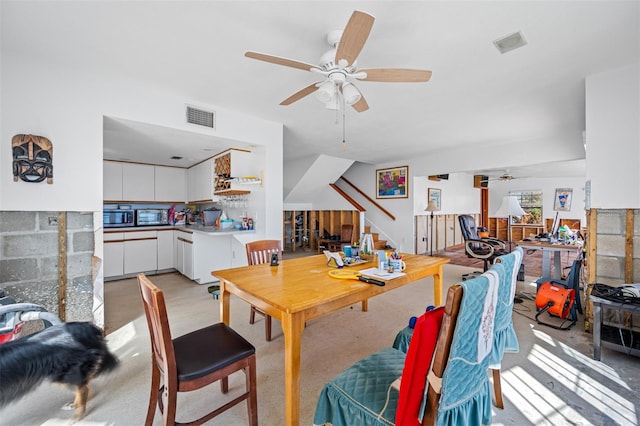 dining space featuring ceiling fan