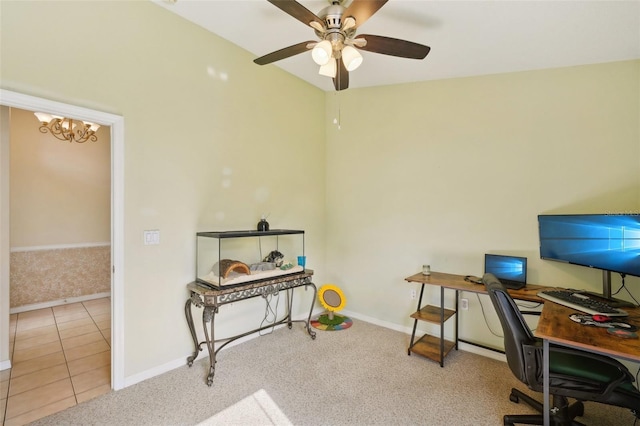 tiled office space featuring ceiling fan with notable chandelier